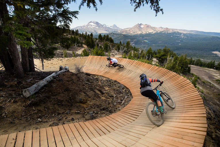 Downhill mountain biker on a forest trail