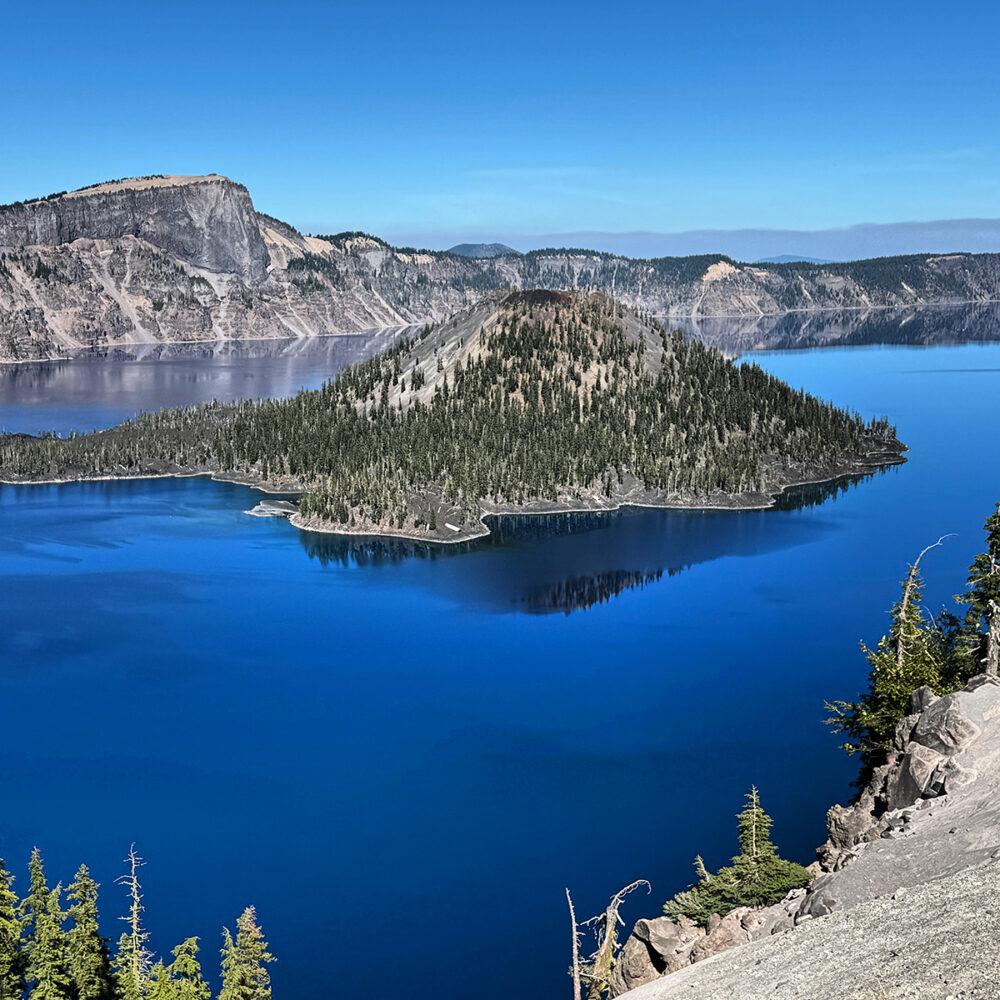 Crater Lake with deep blue water and volcanic rim