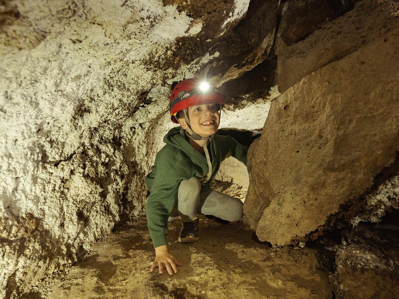 Inside a lava tube cave with a guided group